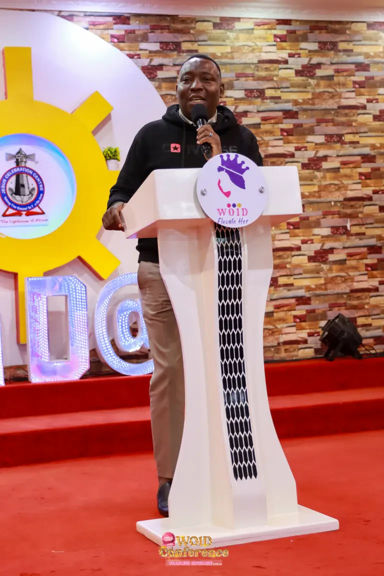 A man speaks at the WOID lectern during the Dinner Night.